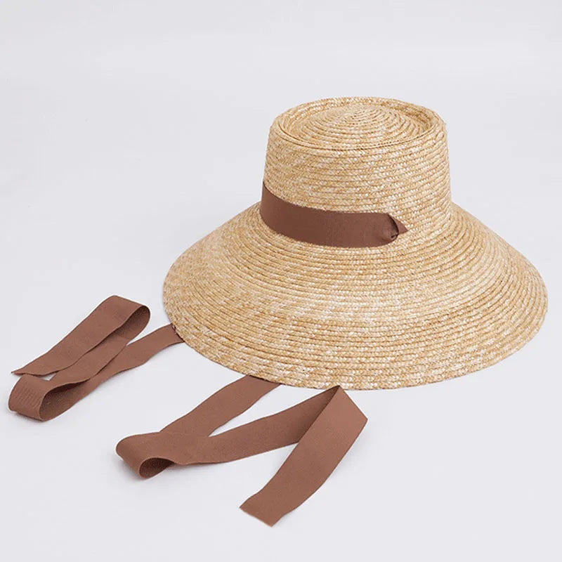 Woman wearing the wide-brim straw sun hat at the beach