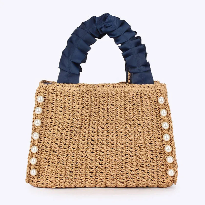 Woven straw texture and handle detail on beach tote